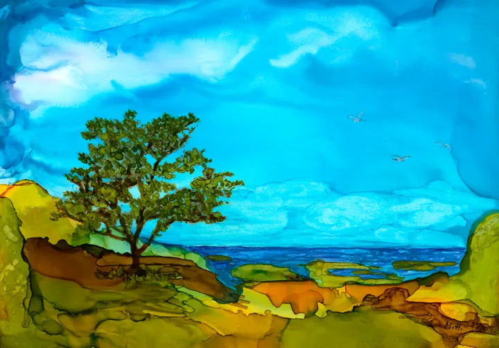 A single windswept tree on a green headland overlooking the sea beneath a wide blue sky