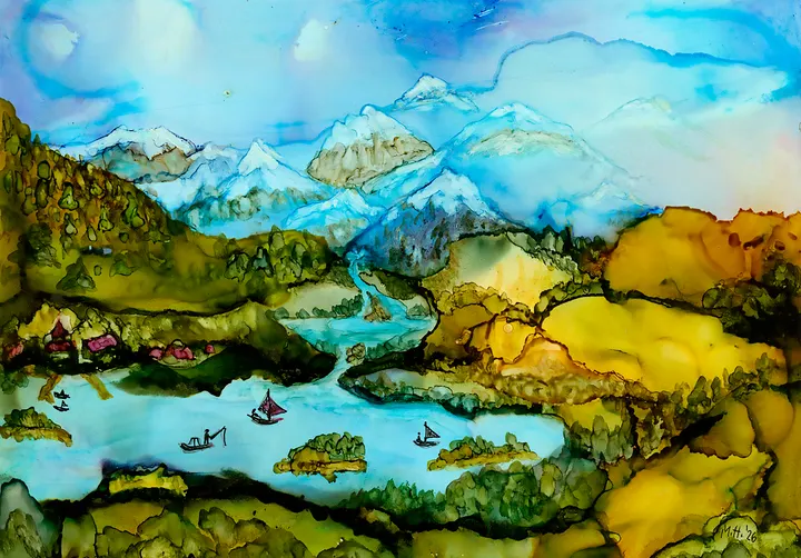 Sailboats on a pale blue lake below snow-capped mountains and golden hills